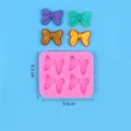 Detalle de molde de silicona para fondant con forma de lazo, medidas y peso de 65g - Estilo Lazo 4 Cavidades (50-3004-A) / Rosa