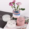 Detail view of round silicone molds and finished decorative resin flower pots - Round Storage Box Bottom and Body Combo Mold (60-762+763)