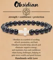 8mm zwarte obsidiaan kralenarmband met wit kruisbedeltje op Engelse cadeaubon-kaart - Obsidiaan