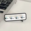 Cute cartoon desktop cable organizer with sweating face emoticon for wire management - Speechless Dog