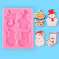 Close-up of pink Christmas silicone mold featuring snowman and stocking designs with finished crafts - Snowman Christmas Sock Style (50-2202-A)