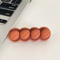 Compact brown four-slot silicone desktop cable organizer showing 6cm x 2cm dimensions - Freedom Coffee
