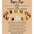 Handgemaakte 8mm tijgeroog kralenarmband met wit kruis en betekeniskaartje - Yellow Tiger Eye Gold Bead