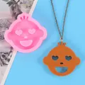 Detail view of heart-eye cartoon face silicone mold and finished resin pendant - Laughing Cartoon Face Style (50-2266-A) / Pink