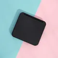 Compact portable folding makeup mirror in matte black finish on split color background - Black