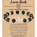 8mm zwarte lavasteen armband met gouden kralen en een wit kruis op displaykaart - Volcanic Stone Gold Beads