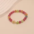 Macro view of a colorful tourmaline crystal beaded bracelet with vibrant candy-colored stones. - Chalcedony Floral Ornament Style