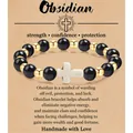 Handgemaakte 8mm obsidiaan kralen armband met wit kruisje op een spirituele cadeaubon - Obsidian Gold Beads