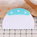 Plastic cake scraper with blue heart handle and scalloped edge for baking decoration - Wave Cutter Style (84066-1)