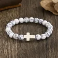 Ελαστικό βραχιόλι με λευκές χάντρες howlite και κρεμαστό σταυρό σε κρεμ χρώμα - White Turquoise (012)