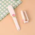 Portable white folding mini hair comb featuring a cute pink tulip flower decoration for students - Tulip Flower