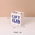 Small white minimalist gift paper bag with blue GIFT text and rope handle, 14x12x7cm - Gift (14x12x7cm)