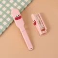 Simpatica spazzola per capelli pieghevole rosa con faccia buffa per viaggi e scuola - Rosa