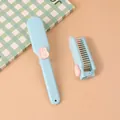 Cute light blue folding mini hairbrush with pink rabbit charm for portable daily travel use - Pink Rabbit