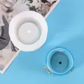 Close-up of a round white silicone mold for DIY succulent pots with a blue sample - 50-2283-D (Round Gold Decor Style)
