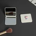 Compact portable folding double-sided makeup mirror with a cute pink cartoon cat charm - Cat Style
