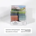 Close-up of 10-roll aesthetic washi tape set in assorted earthy tones and patterns. - Seeking Spring