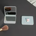 Portable blue folding double-sided makeup mirror with cute white cartoon character - Cartoon Dog Style / Blue