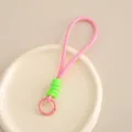 Kreatives geflochtenes Handyband in Pink und Neongrün mit kreisförmigem Metallverschluss - Rosa