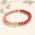 Elegant red cinnabar and south red agate beaded bracelet with a green Hetian jade bead - Empress Cinnabar Southern Red Agate Nephrite Jade Style