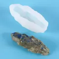 Translucent silicone mold for DIY crystal cluster resin ornaments on solid blue background - 60-686