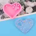 Detail of heart-shaped cat paw silicone mold with finished transparent resin piece - Heart Bear Paw Style (50-2126-A)