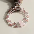 Bracelet double rang en cristal de fraise avec une délicate lune en quartz rose - Style Lune