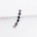 Detailed macro view of gunmetal chain earring with lock charms and magnetic clasp - Lock Ear Bone Clip / Black