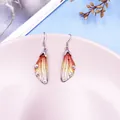 Elegant gradient orange cicada wing drop earrings with sparkling crystal rhinestones. - Silver Style / Orange Gradient