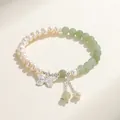 Elegant natural freshwater pearl and green gemstone beaded bracelet with a silver butterfly charm - Nephrite Jade Freshwater Pearl Butterfly Style