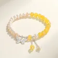Elegant natural freshwater pearl bracelet with yellow beads and silver butterfly charm - Beeswax Freshwater Pearl Butterfly Style