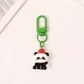 Cute cartoon panda keychain featuring a resin pendant and vibrant green metal hook accessory - Panda with Red Hat