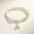 Elegant freshwater pearl bracelet featuring green crystal beads and a silver butterfly charm. - Prehnite Freshwater Pearl Butterfly Style