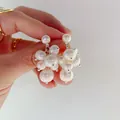 Close-up detail of elegant freshwater pearl cluster earrings in a sweet grape design. - White Grape Cluster Style (Silver Post)