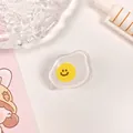 Niedliche transparente Büroklammer aus Acryl in Spiegelei-Form mit gelbem Smiley-Gesicht - Ei