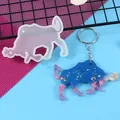 Close-up detail of Taurus constellation resin mold with finished blue glitter keychain - Taurus (60-1005) / 60-1005