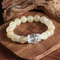 Detalle de pulsera de cuarzo rutilado dorado con espaciadores de plata en madera - Estilo 1 (Bola de Cristal Blanco)