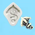 Macro detailed view of a pirate ship anchor silicone mold with a finished fondant product example - Anchor Design (50-854-B)