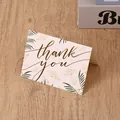 Elegant gold-foiled 'Thank You' greeting card with botanical leaf design on wood surface - Thank You / 7*9.5cm