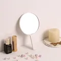 Elegant portable handheld round makeup mirror in minimalist light pink for daily beauty use - Round Mirror / White