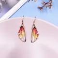 Elegant cicada wing gradient earrings with colorful rhinestones in a soft pink tray - Bronze Style / Orange