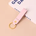 Minimalistische roze PU-lederen sleutelhanger met gouden metalen ring en klinknagel - Roze