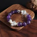 Close-up of natural amethyst beaded bracelet with white pearls and crystal charms - Bowknot Style / Purple and White