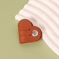Brown heart-shaped PU leather cable organizer with a durable metal snap button closure - Brown