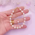 Elegant freshwater pearl bracelet with irregular Baroque beads and gold accents on hand. - Pearl Bracelet