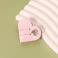 Pink heart-shaped PU leather cable organizer with a metal snap button for earphones - Pink