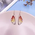 Gradient cicada wing dangle earrings with iridescent rhinestones in a nature-inspired style - Rose Gold / Orange Gradient