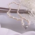Détail d'un collier en perles d'eau douce baroques avec fermoir magnétique coeur argenté - Collier de Perles Irrégulières Ratio 37 / Perle d'eau douce / Argent