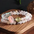 Macro view of double-strand crystal bracelet with amethyst, citrine and rose quartz beads - Purple Jadeite Double Loop Bracelet