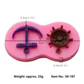 Pink silicone mold featuring anchor and nautical ship wheel for fondant and chocolate - Anchor and Helm Design (50-187-A)